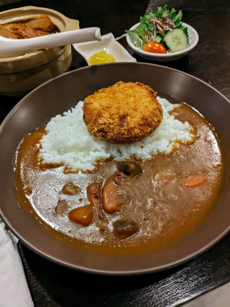 Bowl of curry with rice and vegetables