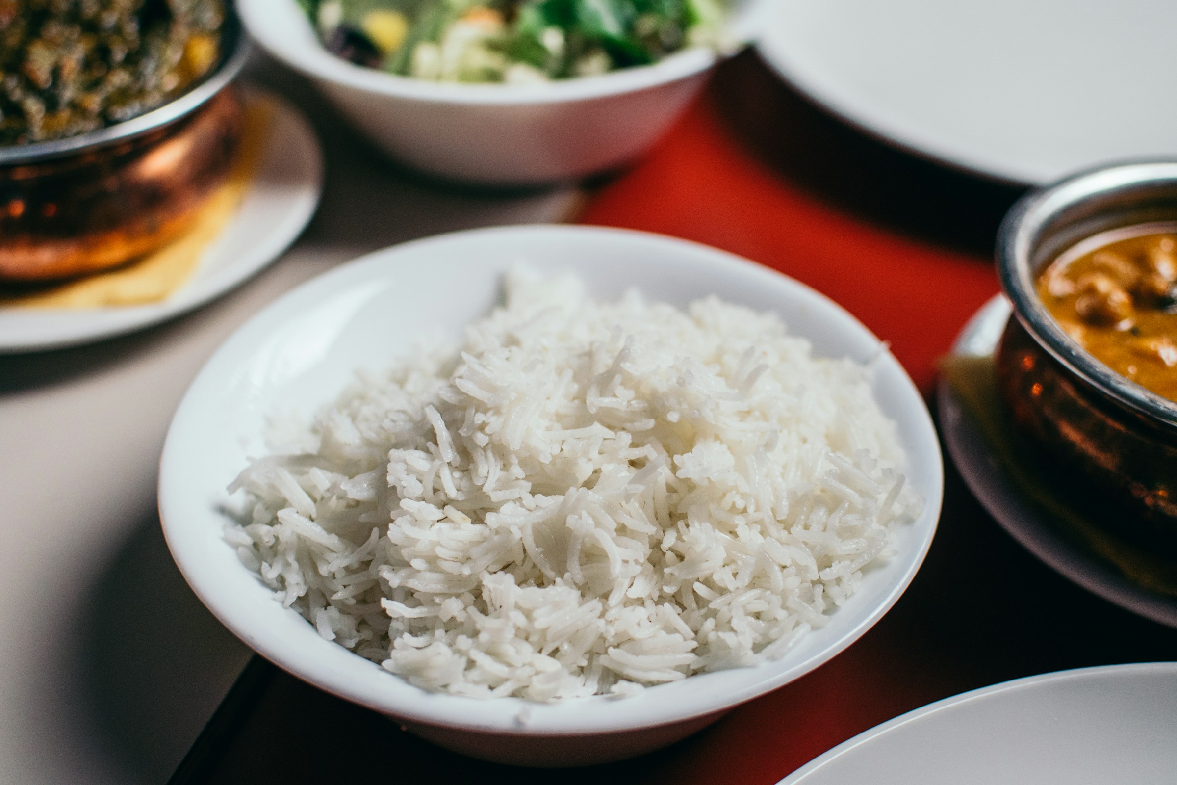 Bowl of cooked rice showing serving size portion per person